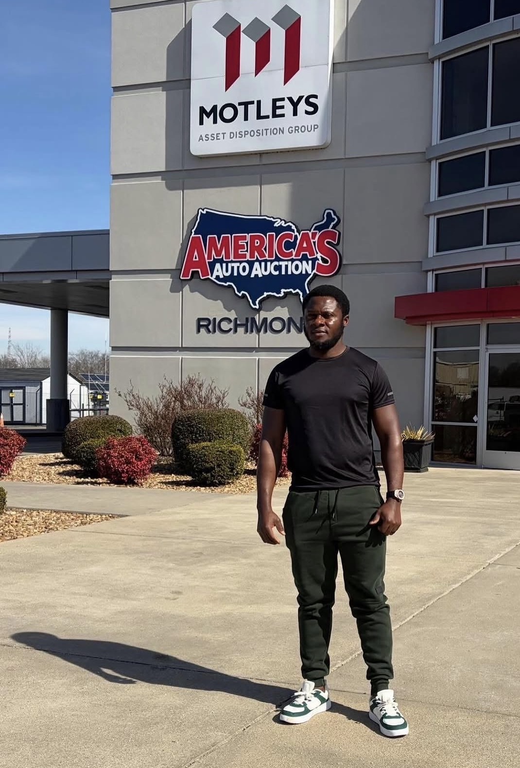 Car dealer or sales manager offers to sell a car and explains terms of car contract signing and insurance handshake after signing contract and paying successfully vertical image